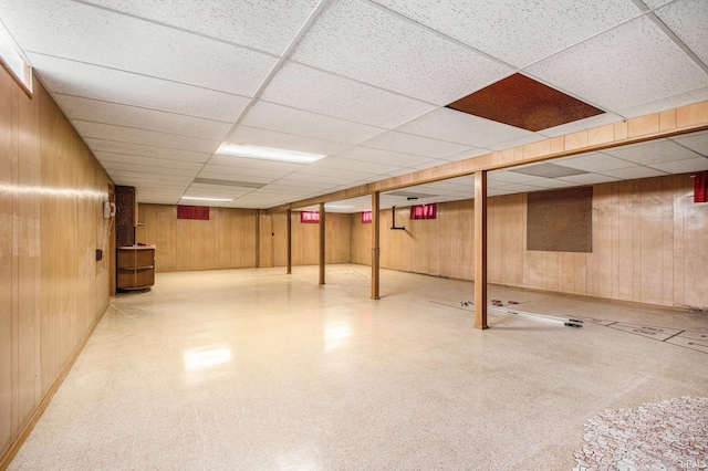 56226 Tanglewood Ln, Osceola, IN 46561 - finished below grade area with wooden walls, tile patterned floors, and a drop ceiling