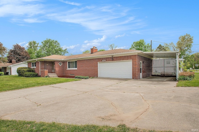 56226 Tanglewood Ln, Osceola, IN 46561 - ranch-style house with brick siding, an attached garage, a chimney, and a front lawn