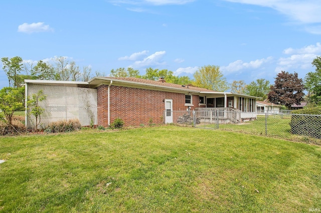 56226 Tanglewood Ln, Osceola, IN 46561 - back of property with brick siding, a sunroom, and a chimney