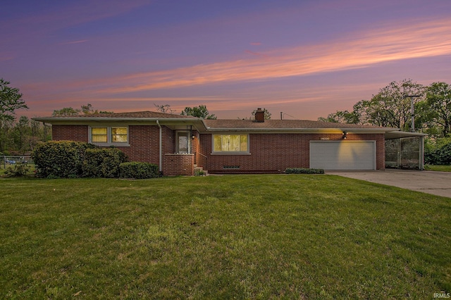56226 Tanglewood Ln, Osceola, IN 46561 - single story home featuring a garage, concrete driveway, a lawn, brick siding, and a chimney