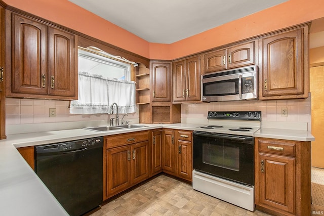 56226 Tanglewood Ln, Osceola, IN 46561 - kitchen with stainless steel microwave, electric range oven, dishwasher, a sink, and brown cabinets