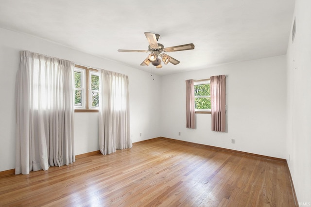 56226 Tanglewood Ln, Osceola, IN 46561 - spare room featuring light wood-style flooring, baseboards, and ceiling fan