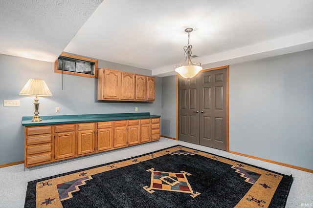 interior space featuring light colored carpet and baseboards
