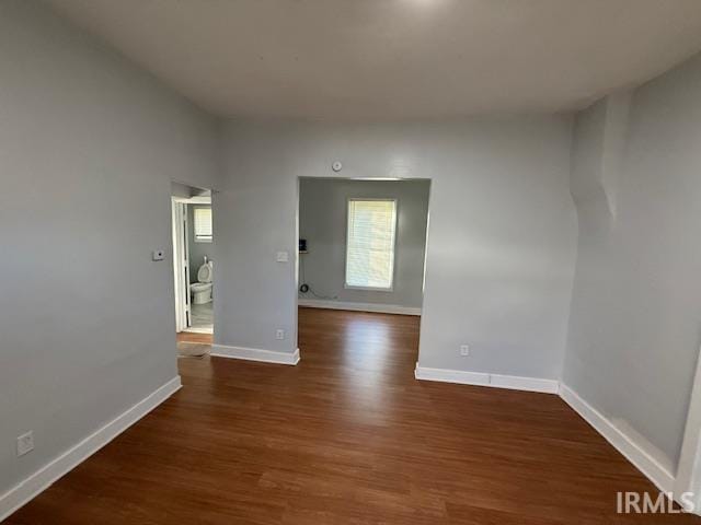 1710 Sibley Ave, South Bend, IN 46628 - spare room featuring wood finished floors and baseboards