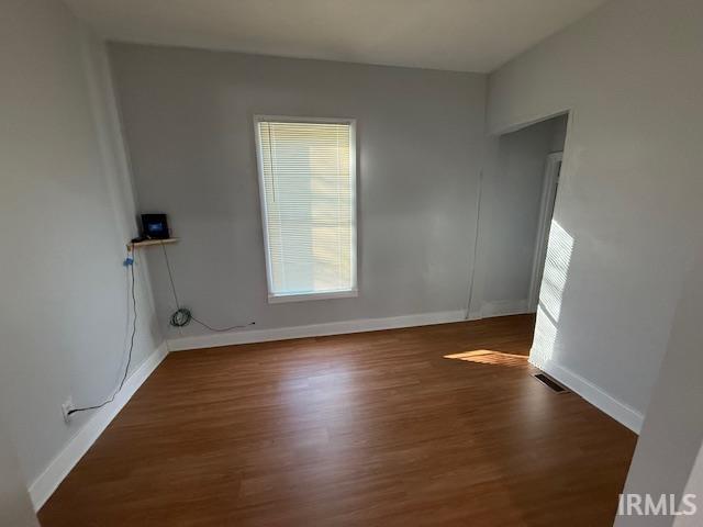 1710 Sibley Ave, South Bend, IN 46628 - spare room with wood finished floors and baseboards