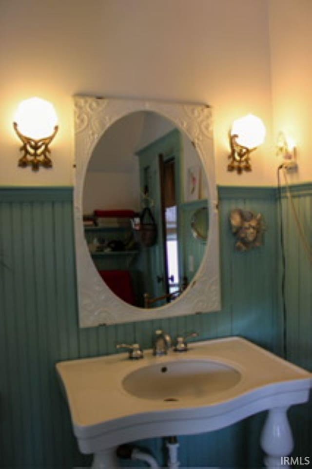 127 W Mill St, Bremen, IN 46506 - bathroom featuring a wainscoted wall and a sink