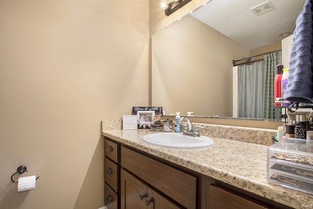 full bath with vanity and a shower with shower curtain
