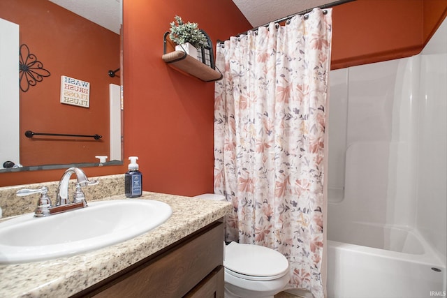 bathroom with a textured ceiling, toilet, vanity, and shower / bathtub combination with curtain