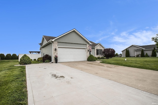 view of front of house with concrete driveway, a garage, a front yard, and brick siding
