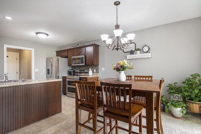 dining space with a chandelier