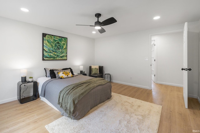 bedroom featuring light wood-style flooring, recessed lighting, baseboards, and ceiling fan