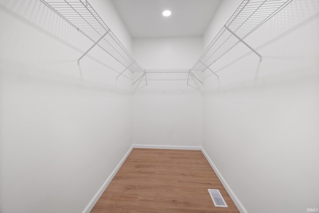 spacious closet with light wood-style floors