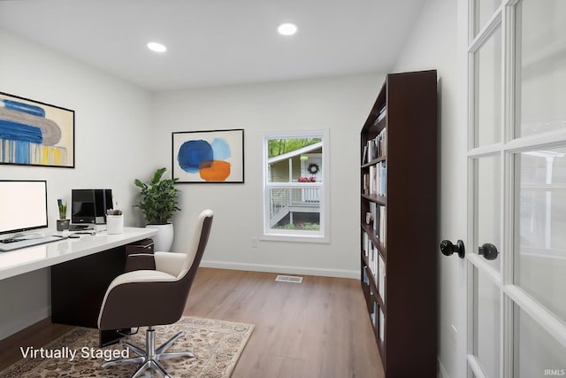 office with light wood-type flooring, baseboards, and recessed lighting
