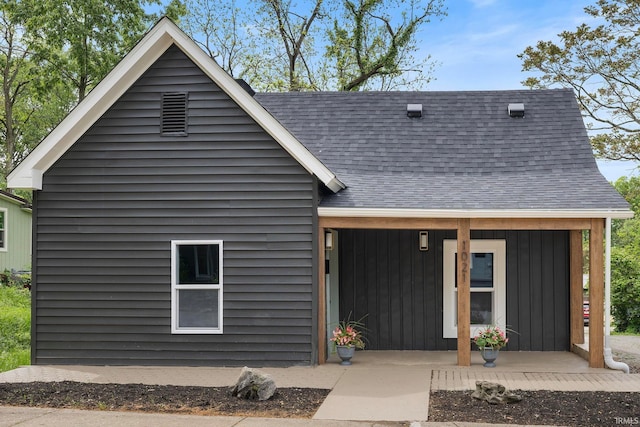 view of front of property with roof with shingles