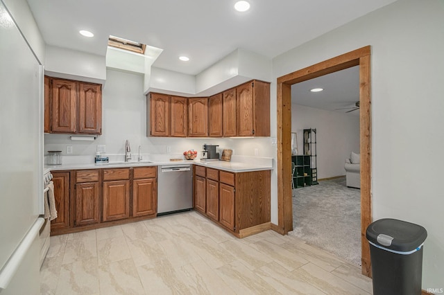 5480 E 900 N, Syracuse, IN 46567 - kitchen featuring stainless steel dishwasher, a sink, brown cabinetry, white fridge, and light countertops