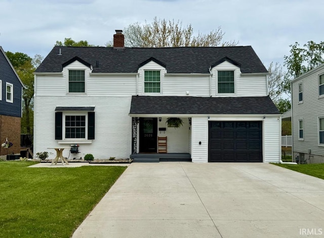 view of front facade featuring a chimney, a front lawn, concrete driveway, an attached garage, and roof with shingles