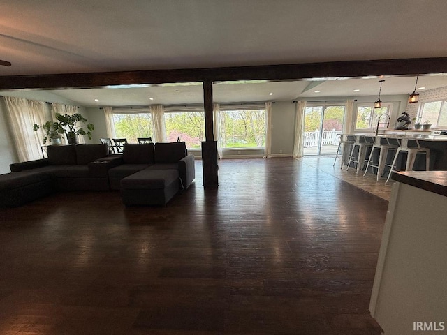 living area featuring dark wood-type flooring and recessed lighting