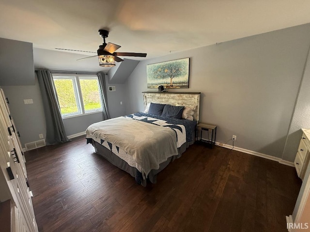 bedroom with dark wood-style flooring, baseboards, lofted ceiling, and ceiling fan