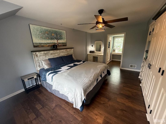 bedroom featuring wood finished floors, baseboards, and ceiling fan