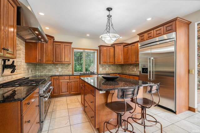 51205 County Road 25th Rd, Bristol, IN 46507 - kitchen with premium appliances, island range hood, brown cabinets, and recessed lighting