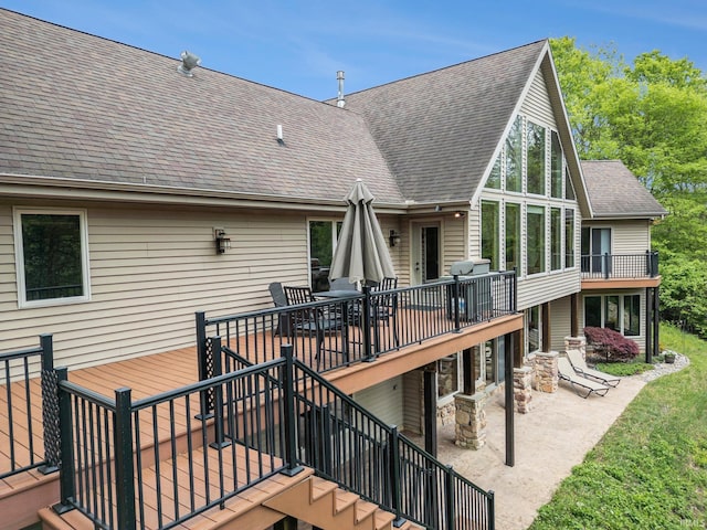 51205 County Road 25th Rd, Bristol, IN 46507 - rear view of house featuring a patio, a shingled roof, stairs, a deck, and outdoor dining area