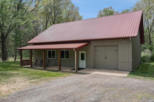 51205 County Road 25th Rd, Bristol, IN 46507 - view of front of property featuring dirt driveway, metal roof, and a front lawn