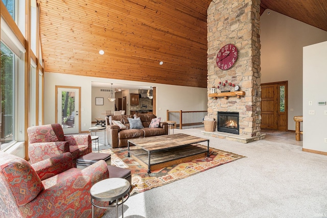 51205 County Road 25th Rd, Bristol, IN 46507 - living area featuring high vaulted ceiling, wooden ceiling, a stone fireplace, carpet floors, and baseboards