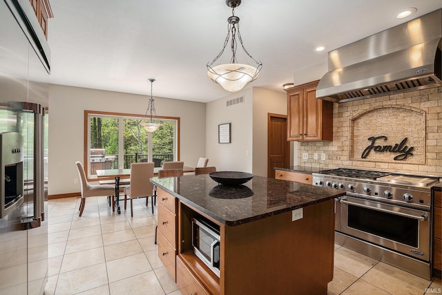 51205 County Road 25th Rd, Bristol, IN 46507 - kitchen featuring stainless steel appliances, wall chimney exhaust hood, decorative backsplash, light tile patterned floors, and a center island
