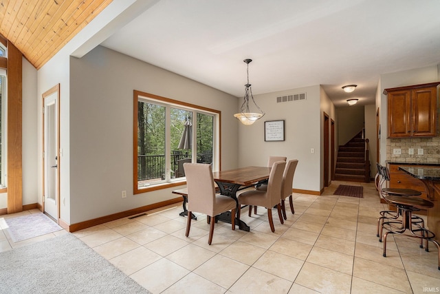 51205 County Road 25th Rd, Bristol, IN 46507 - dining room featuring stairway, light tile patterned floors, baseboards, and lofted ceiling