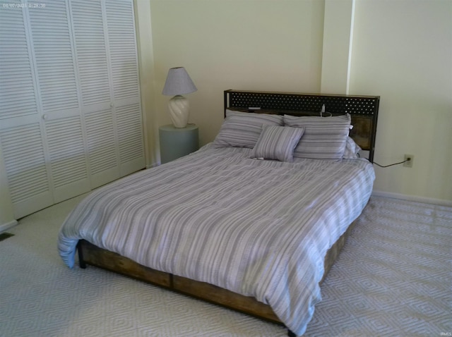 4068 E Eagle Bay Dr Unit 46, Bloomington, IN 47401 - bedroom with carpet, baseboards, and a closet