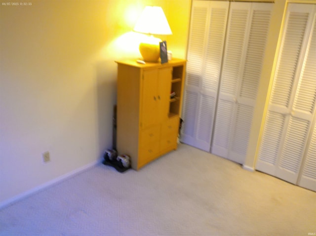 4068 E Eagle Bay Dr Unit 46, Bloomington, IN 47401 - unfurnished bedroom with carpet flooring, baseboards, and a closet