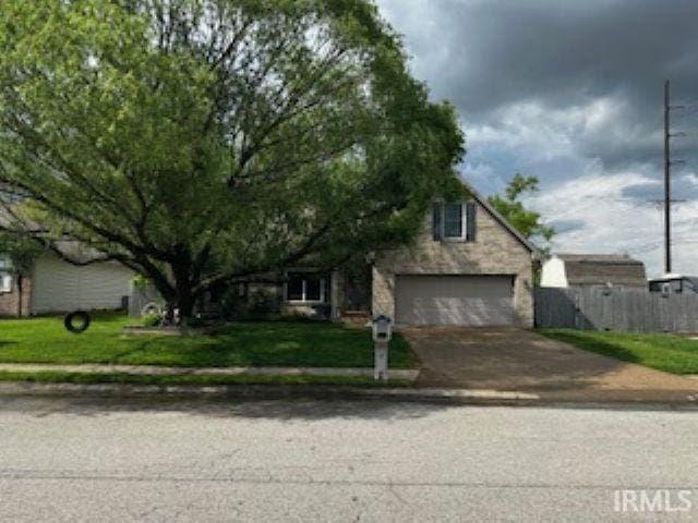 4732 Rathbone Dr, Evansville, IN 47725 - view of property hidden behind natural elements with concrete driveway
