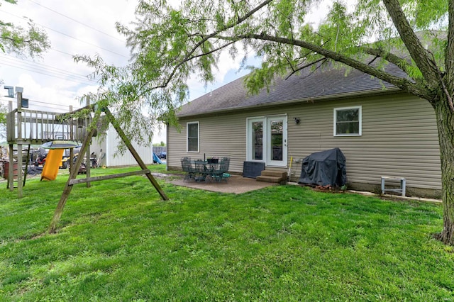 4732 Rathbone Dr, Evansville, IN 47725 - rear view of property with entry steps, a patio, a lawn, and a shingled roof