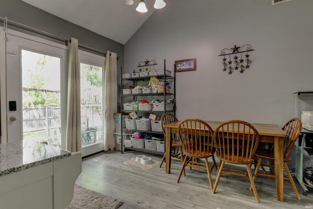 4732 Rathbone Dr, Evansville, IN 47725 - dining room with light wood-style flooring and high vaulted ceiling