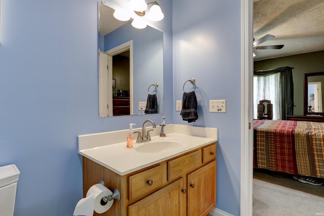 4732 Rathbone Dr, Evansville, IN 47725 - bathroom featuring vanity, ceiling fan, and toilet