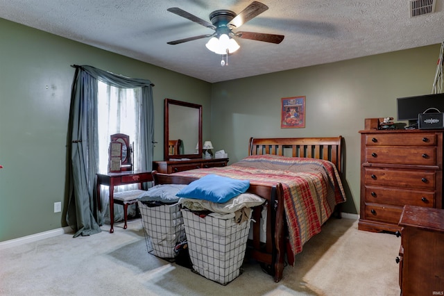 4732 Rathbone Dr, Evansville, IN 47725 - carpeted bedroom featuring a textured ceiling, baseboards, and a ceiling fan