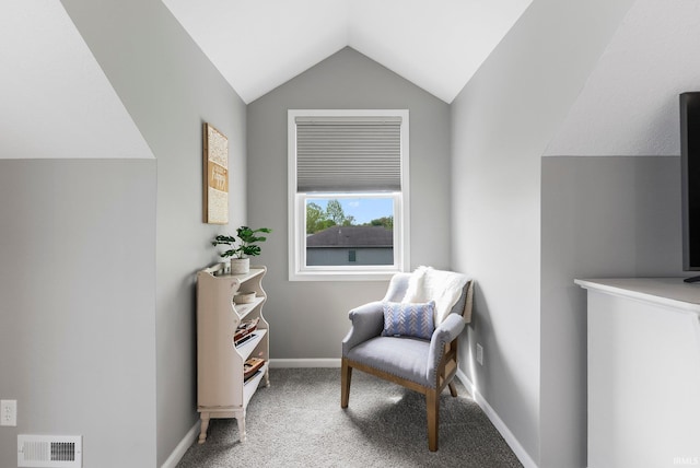 sitting room with lofted ceiling, carpet floors, and baseboards
