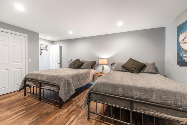 bedroom featuring wood finished floors and recessed lighting