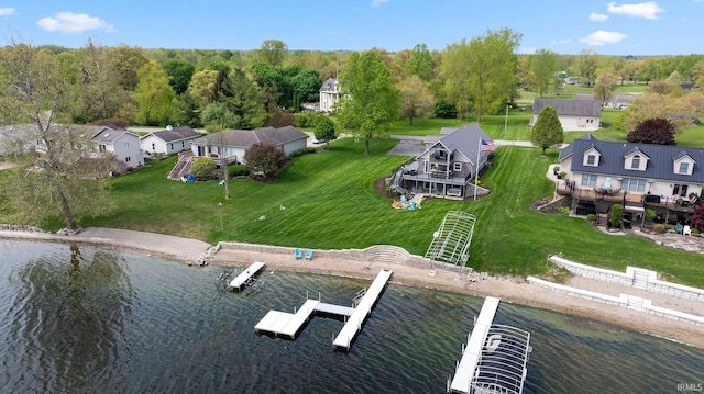 aerial perspective of suburban area with a large body of water