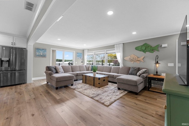 living area with crown molding, light wood-type flooring, recessed lighting, and baseboards