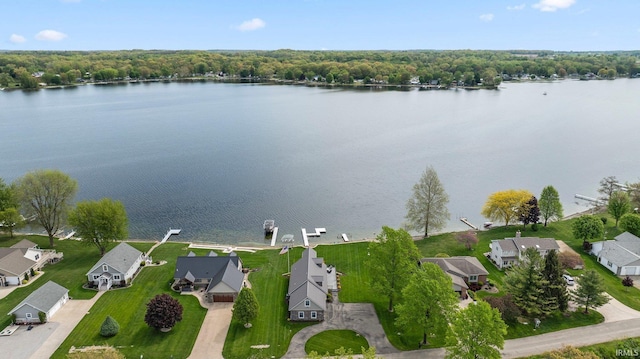aerial perspective of suburban area featuring a nearby body of water