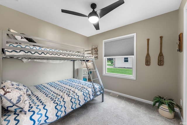 bedroom with carpet, baseboards, and a ceiling fan