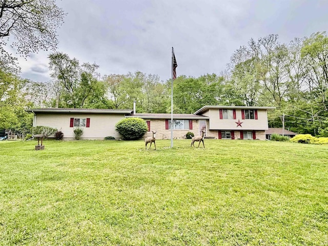 4203 Logansport Rd, Logansport, IN 46947 - view of front of house with a front lawn and view of wooded area