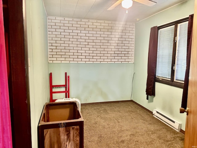4203 Logansport Rd, Logansport, IN 46947 - unfurnished room featuring a baseboard heating unit, a ceiling fan, and carpet floors