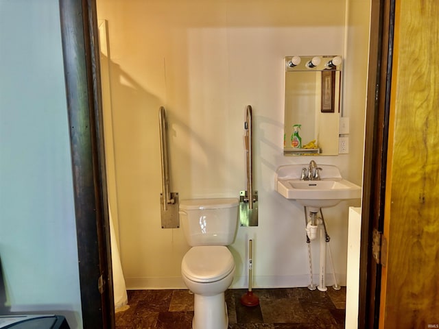 4203 Logansport Rd, Logansport, IN 46947 - bathroom with toilet and baseboards