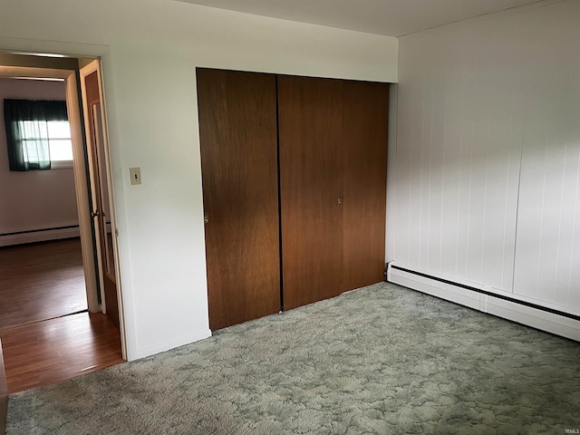 3212 S Saint Joseph St, South Bend, IN 46614 - unfurnished bedroom featuring carpet flooring, a closet, baseboard heating, and baseboards