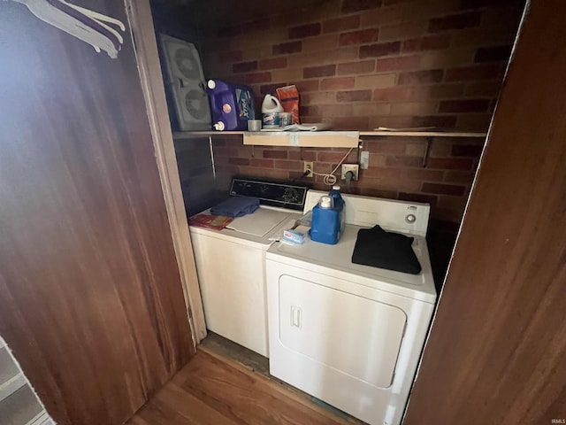 3212 S Saint Joseph St, South Bend, IN 46614 - laundry area with separate washer and dryer and wood finished floors