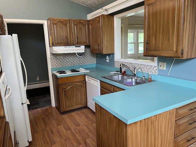 3212 S Saint Joseph St, South Bend, IN 46614 - kitchen with under cabinet range hood, a sink, white appliances, a baseboard radiator, and wood finished floors