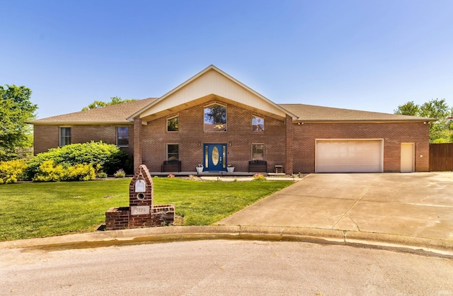 509 Mount Ashley Rd, Evansville, IN 47711 - view of front facade featuring an attached garage, a front yard, brick siding, and concrete driveway
