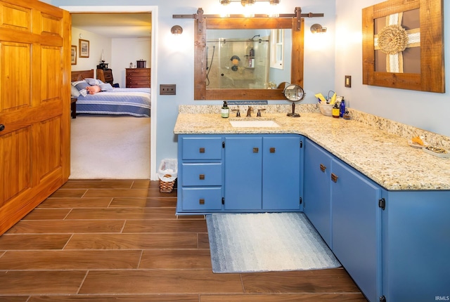 509 Mount Ashley Rd, Evansville, IN 47711 - ensuite bathroom with wood finish floors, a shower stall, and vanity